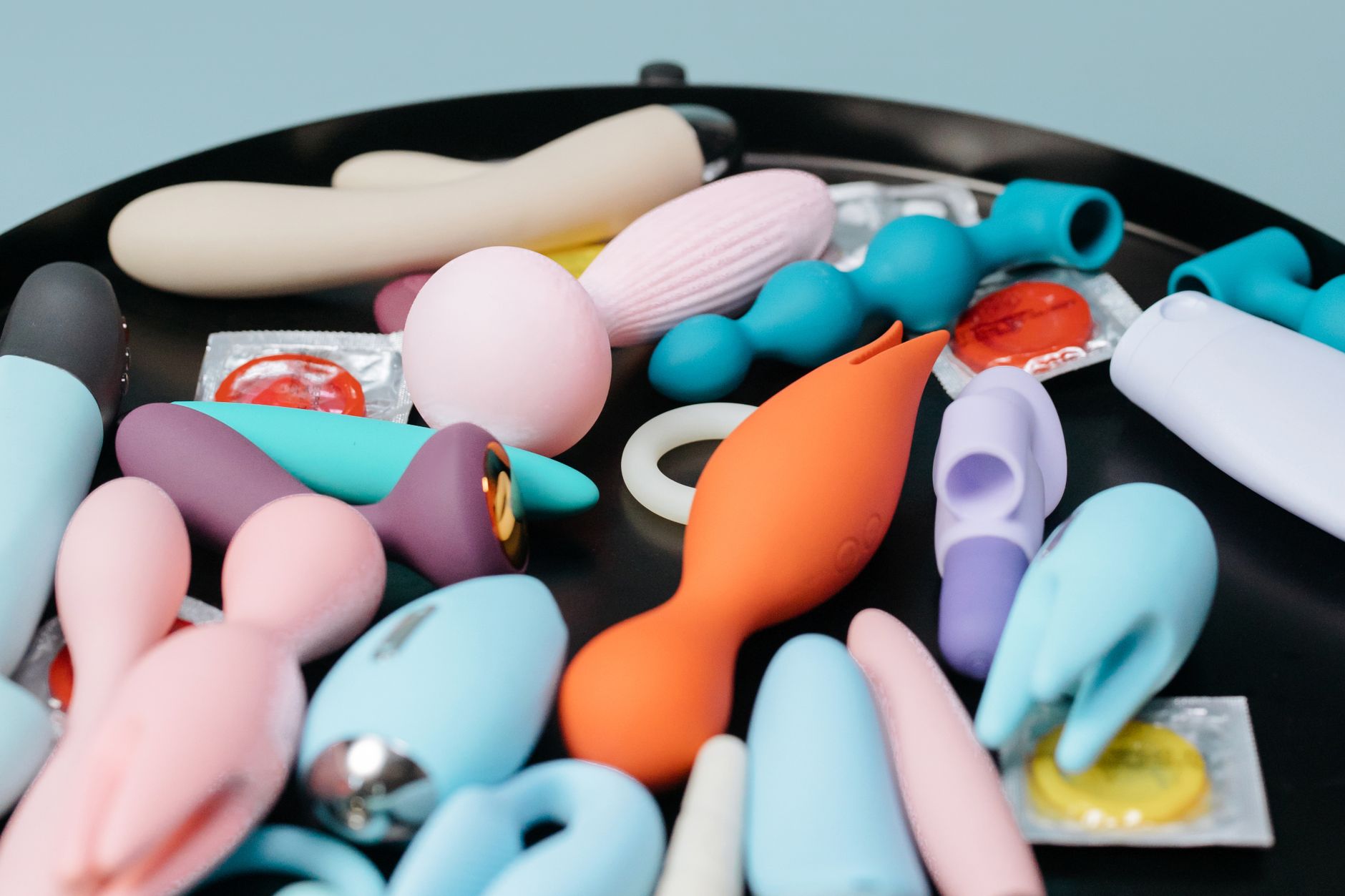 A vibrant collection of lemon clitoral vibrators and intimate wellness products displayed on a surface
