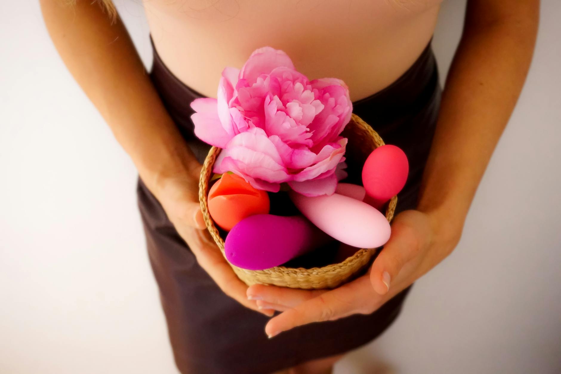 Colorful arrangement of flowers and abstract objects on bright yellow background